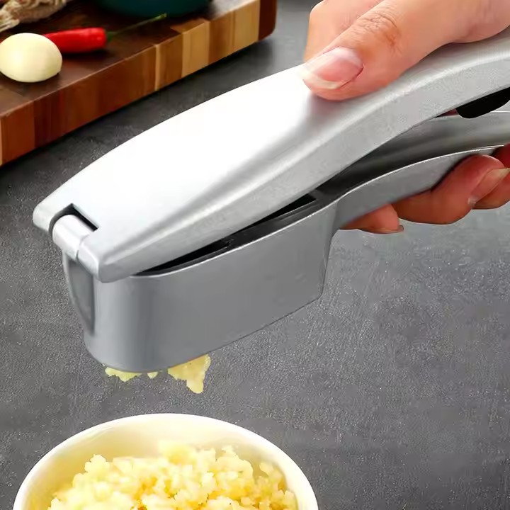 Stainless steel multi-use kitchen garlic press